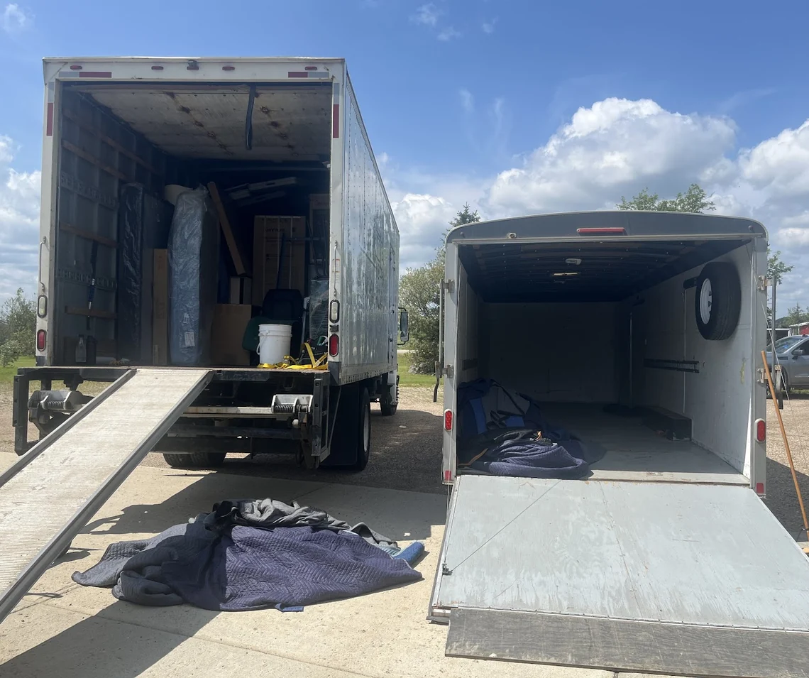 Fast Track Muskoka moving truck and enclosed trailer open and ready to load on a summer day